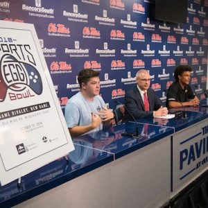 At left, Cray Pennison, president of the Ole Miss Esports club, is joined by Noel Wilkin, University of Mississippi provost and executive vice chancellor, and Jason DeShong, president of MSU Esports, to announce the Esports Egg Bowl set for Sat., Oct. 13, in The Pavilion at Ole Miss. Photo by Kevin Bain.