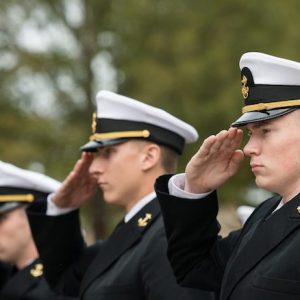 Navy ROTC midshipmen salute during the annual Chancellor’s Pass in Review ceremony Nov. 8 in front of the Lyceum. The annual tradition is designed to inspect troop readiness and features cadets and midshipmen from the UM Army, Navy/Marine and Air Force ROTC programs. Photo by Megan Wolfe