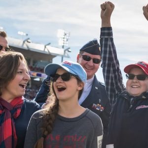 Ole Miss Wish Kid Benjamin Clark celebrates with his family when he hears that he is going to Disney World courtesy of the nonprofit Walkers for Warriors and the Student Veterans Association. Photo by Megan Wolfe