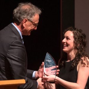 Douglass Sullivan-Gonzalez (left), dean of the UM Sally McDonnell Barksdale Honors College, presents the 2019 Barksdale Award to Maureen Maher during the annual spring Honors Convocation. Photo by Kevin Bain/