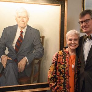Kay Cochran and artist Jason Bouldin present Sen. Thad Cochran’s portrait that has been installed in the University of Mississippi research center bearing the senator’s name. Photo by Thomas Graning/