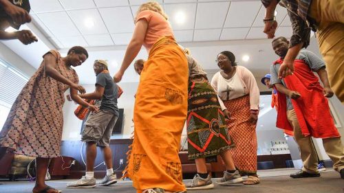 Neema Loy (left), a graduate teaching assistant from Tanzania, leads UM students in her Swahili language class in traditional Tarab dances. Photo by Robert Jordan/UM Communications