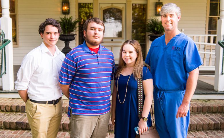 Dr. Preston Lee (right) of Oxford, Mississippi, greets recipients of the scholarships he and his wife, Elise Hayles Lee, established at the University of Mississippi. Students (from left) are Patrick Jenkins, a history major from Coldwater, Mississippi, who received the Lee Family Dentistry Scholarship in recognition of the Tate County community, where Lee has a clinic; Herman Story, a computer science major from Oxford, who received the Lisa Jacob Hayles Scholarship in honor of Lee's mother-in-law; and Avery Duke, a biology major from Oxford, who received the Karen Crocker Lee Scholarship in honor of Lee's mother who graduated from Ole Miss in 1973 with a bachelor’s degree in education.