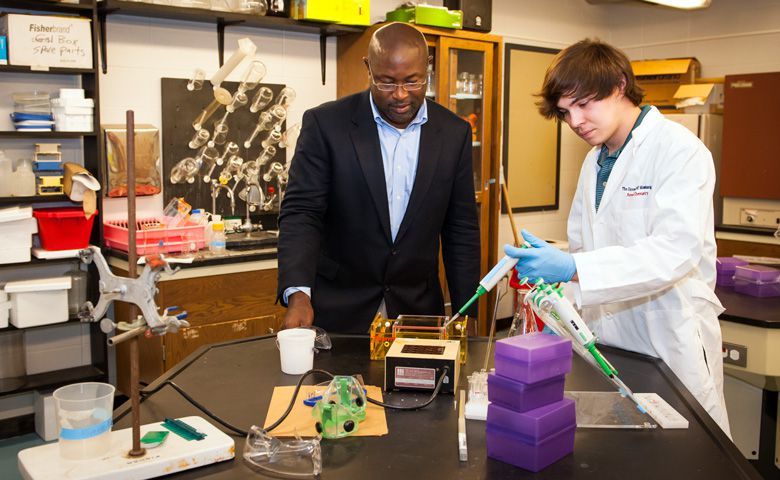 Dr. Murrell Godfrey (left), director of forensic chemistry, talks Embry scholar Lane Killough through the beginning stages of running a polymerase chain reaction (PCR). Forensic chemists use the PCR process to duplicate DNA until the sample size is large enough to analyze. The University of Mississippi has one of only five accredited forensic chemistry programs in the nation.