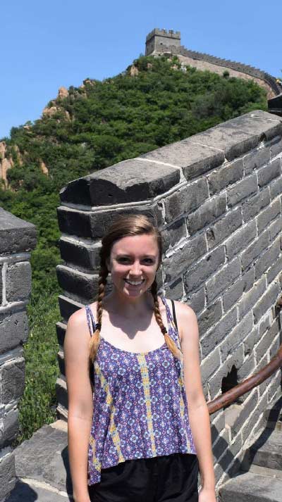 Tyler Caple poses on the Great Wall during one of her study abroad trips. Submitted photo
