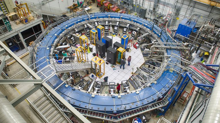 Scientists install equipment and prepare the Muon g-2 ring, a 50-foot electromagnet, to take muons at the Fermi National Accelerator Laboratory. The work is part of an experiment to determine whether undetected elementary particles exist or if the Standard Model of Physics is complete. Photo courtesy Fermilab