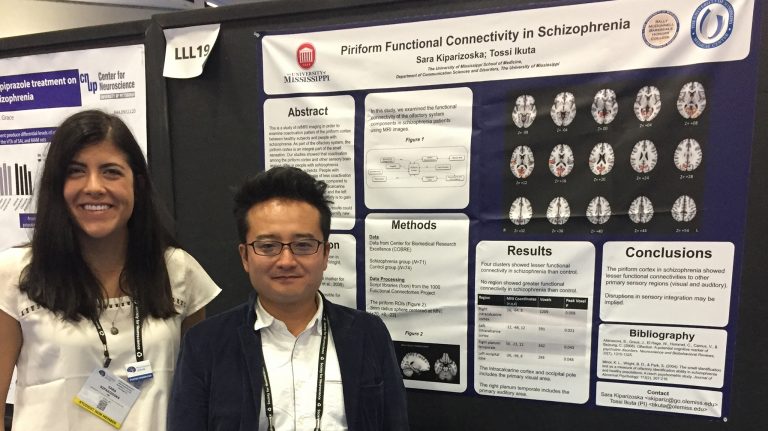 Sara Kiparizoska (left), a 2016 UM biochemistry graduate, and Tossi Ikuta, assistant professor of communication sciences and disorders, show off a poster detailing their research at the National Society for Neuroscience Convention in San Diego. Submitted photo