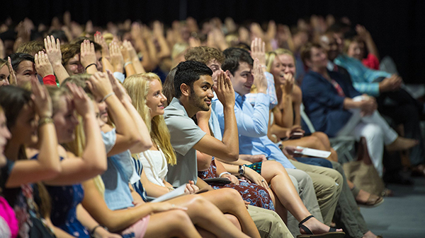 Freshmen throw up the Landshark sign during the University of Mississippi’s Fall Convocation. The university enrolled 3,697 freshmen this fall and 23,780 students overall. Photo by Kevin Bain/Ole Miss Communications