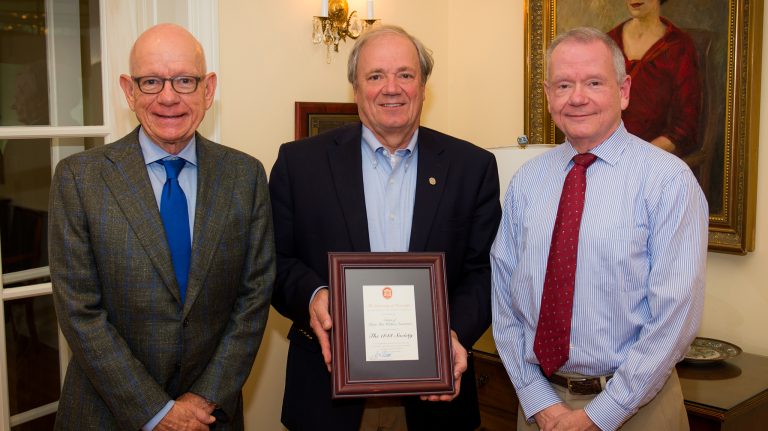 UM Foundation President and CEO Wendell Weakley (center) presents Mike Overstreet (left) and Larry Overstreet with a plaque, recognizing their mother’s generous estate gift to the Ole Miss Opportunity Scholarship program. UM Photo by Bill Dabney