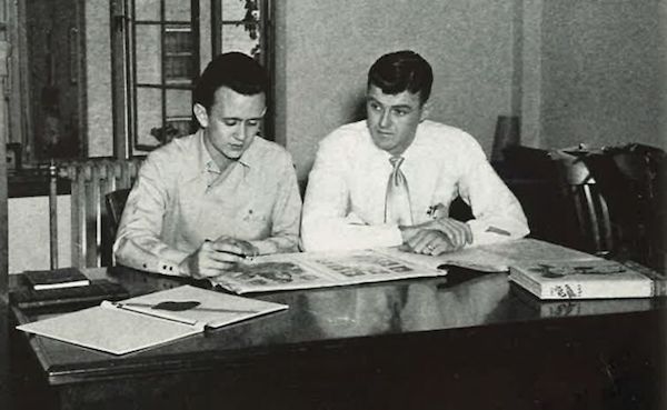 As Ole Miss yearbook editor, Buddy Shaw (left) and Jimmy Parkin, yearbook business manager, review the layout for the 1950 edition.