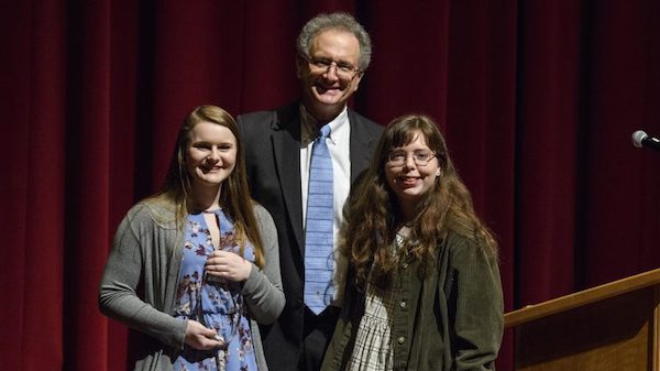Gabrielle Schust (left) and Bethany Fitts are congratulated by Dean Douglass Sullivan-González after receiving Barksdale Awards during the Honors College’s annual spring convocation. Photo by Thomas Graning/Ole Miss Communications