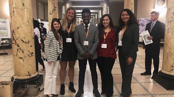University of Mississippi students (left to right) Madison Savoy, Abigail Garrett, Cellas Hayes, Lindsey Miller and Brittany Brown present their undergraduate research during Posters in the Rotunda March 20 at the state Capitol. Photo by Shea Stewart/University Communications
