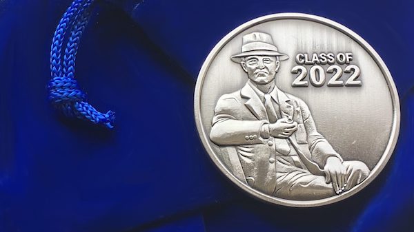 The Class of 2022’s commemorative coin depicts William Faulkner. 