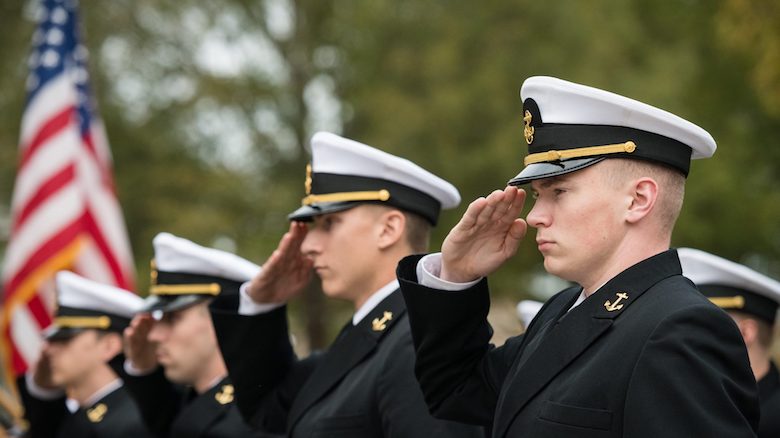 Navy ROTC midshipmen salute during the annual Chancellor’s Pass in Review ceremony Nov. 8 in front of the Lyceum. The annual tradition is designed to inspect troop readiness and features cadets and midshipmen from the UM Army, Navy/Marine and Air Force ROTC programs. Photo by Megan Wolfe