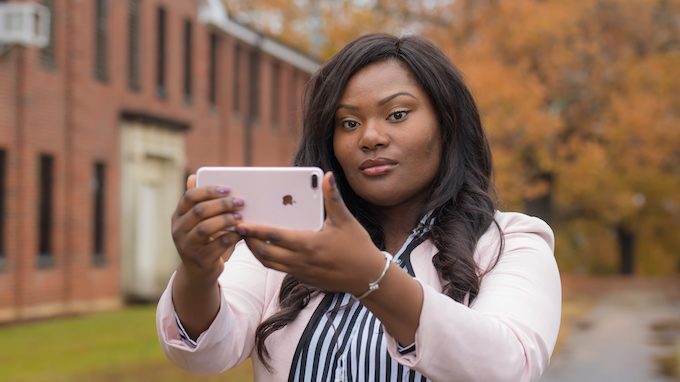 UM sophomore Yasmine Malone uses her iPhone to take photos that have appeared in The New York Times. Photo by Kevin Bain/Ole Miss Digital Imaging Services