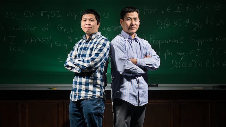 University of Mississippi Math Professors Thái Hoàng Lê, left, and Dao Nguyen, right, both hold gold medals in the International Mathematical Olympaid as high school students in the 1990s. Photo by Megan Wolfe