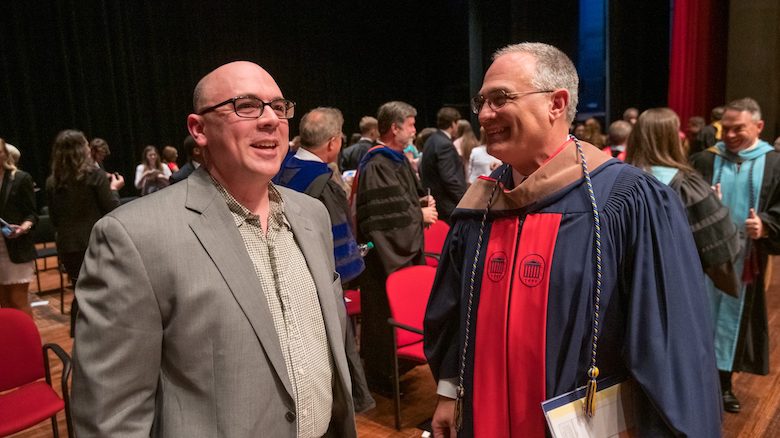 UM psychology professor John Young (left) talks with Interim Chancellor Larry Sparks after receiving the 2019 Elsie M. Hood Teacher of the Year Thursday evening (April 4) at Honors Convocation. Photo by Kevin Bain/Ole Miss 