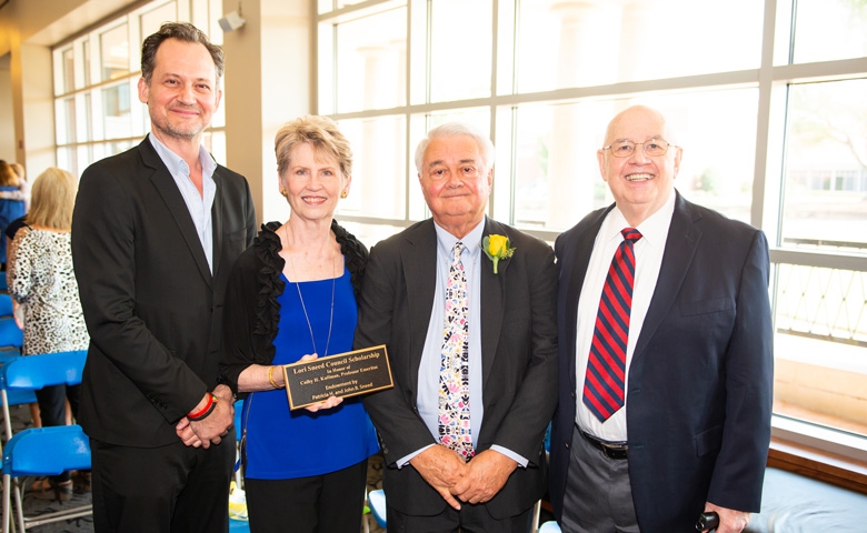 Members of the late Lori Sneed's family -- (from left) brother Johnny, mother Patti, and father Shorty Sneed -- are joined by honoree Colby Kullman (right) at a recent Ole Miss Women's Council Rose Garden.