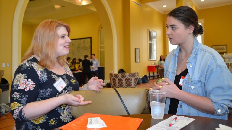 Kayleigh Webb (left) an associate publicist with HarperCollins Publishers, shares career advice with UM junior Emily Capponi, of Seattle. Webb advised students at the networking event to accept ‘no’ graciously during their job search because in her case, those rejections eventually led her to a fulfilling career. Photo by Pam Starling/Division of Outreach 