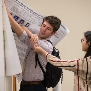 A UM student sets up for his poster presentation at the fifth annual University of Mississippi Research Day. The event brought together researchers from the Oxford campus and the University of Mississippi Medical Center to learn about one another’s research interests and possibilities for collaboration. Photo by Megan Wolfe