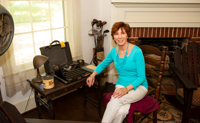 Sandy Black sits in the office of William Faulkner’s home.