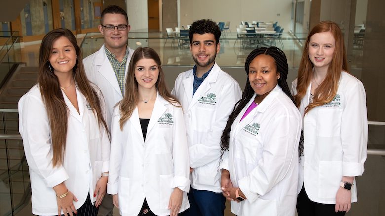 UM students and alumni who have been selected for the the undergraduate portion of the Mississippi Rural Physicians Scholarship Program for 2019 are (from left) Jamie Johnson, Cole Stephens, Katelyn Barnes, Nader Pahlevan, Jamie Riggs and Riley Brown. Photo by Jay Ferchaud